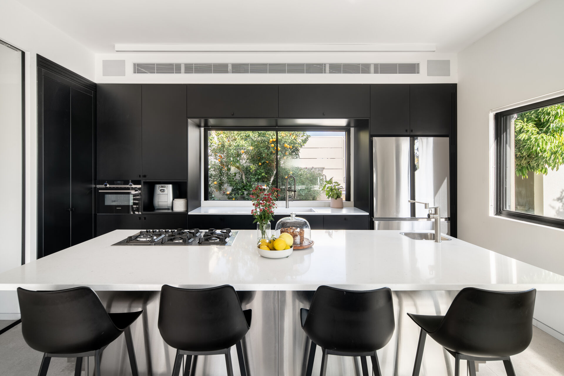 Black kitchen designed by Studio Michal Friedman